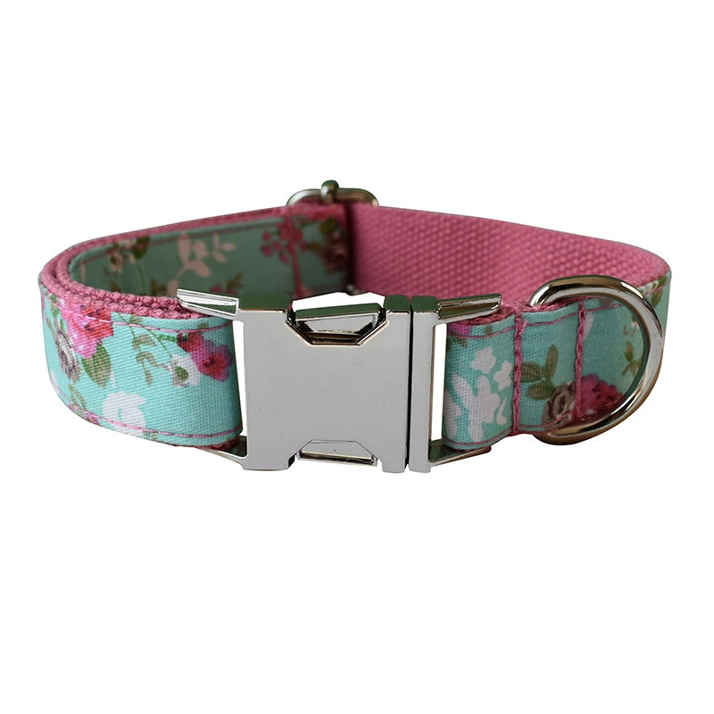 Floral-patterned dog collar with a metal buckle on a white background