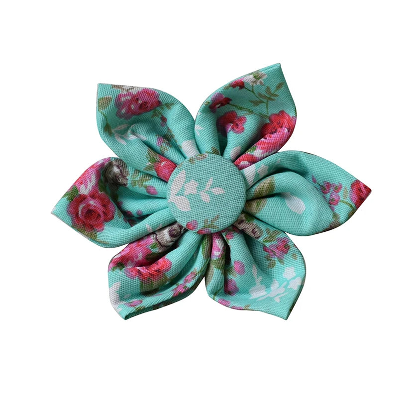 Floral fabric flower with pink roses and green leaves on a white background