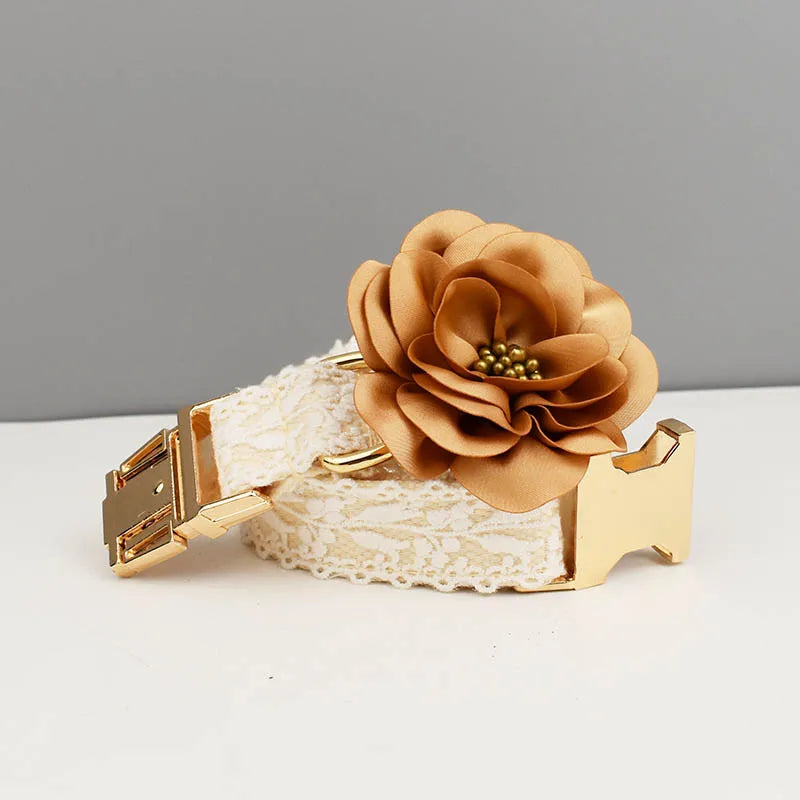 Belt with a decorative flower and gold buckle on a gray background