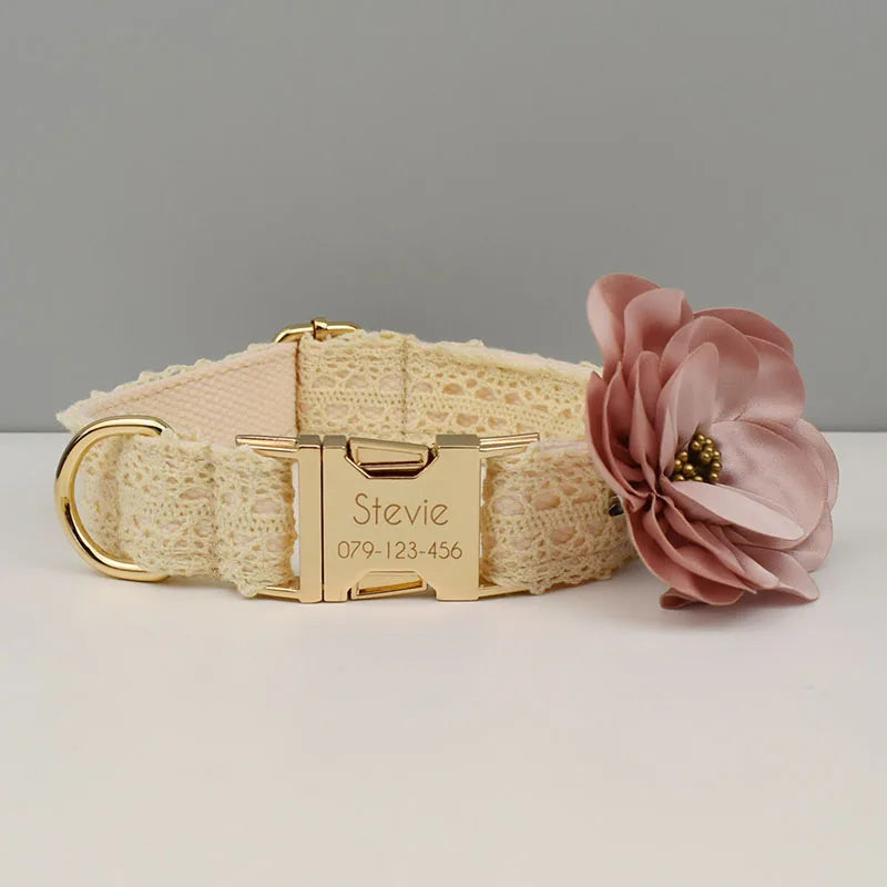 Dog collar with floral accessory and gold buckle on a gray background