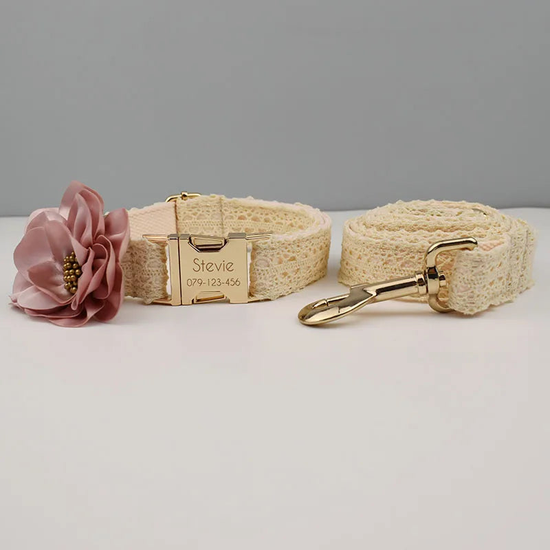 Dog collar with floral attachment and leash on a gray background