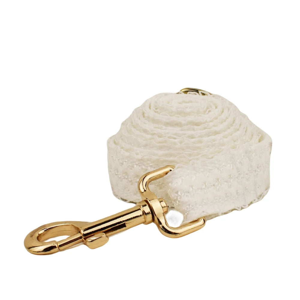 White rope with gold metal clasp on a white background