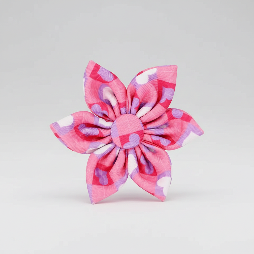 Pink and purple checkered bow on a light gray background