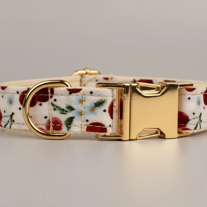 Floral-patterned dog collar with gold buckle on a light gray background
