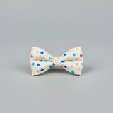 Bow tie with heart pattern on a gray background