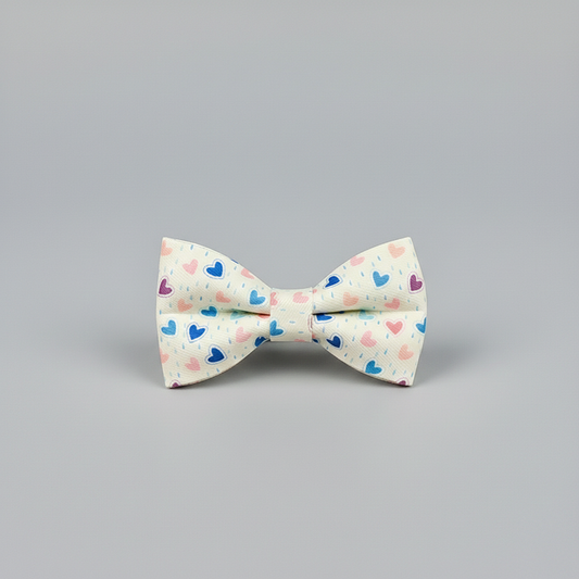 Bow tie with heart pattern on a gray background