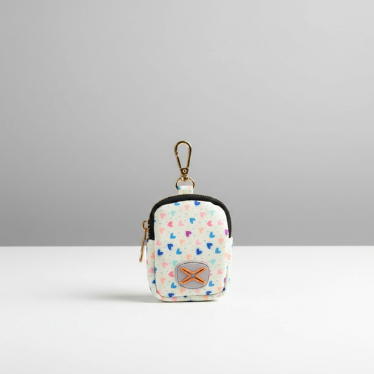 Small waste bag holder with heart pattern on a gray background