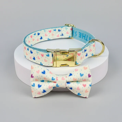Dog collar and bow tie set with heart pattern on a gray background