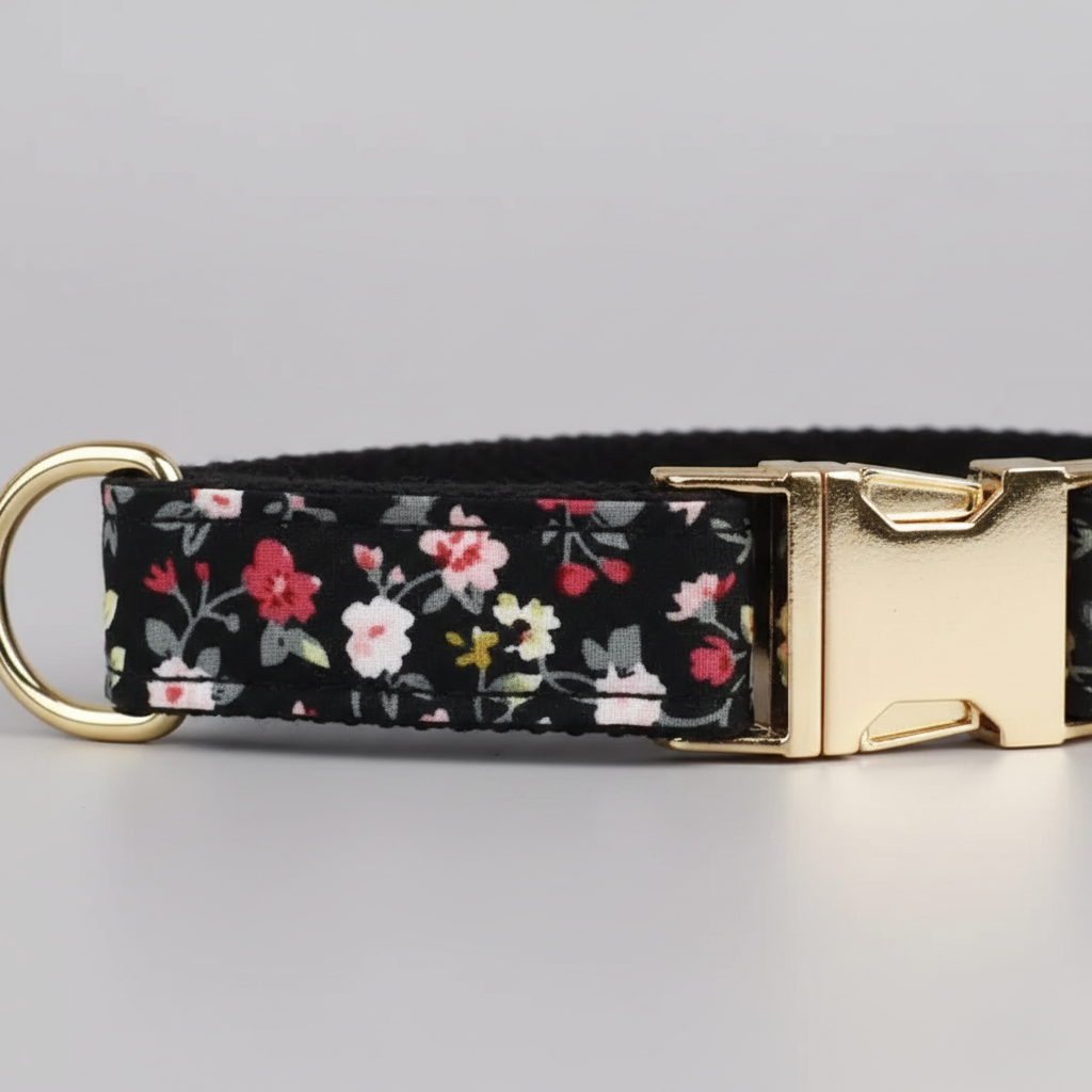 Floral-patterned dog collar with gold buckle on a gray background