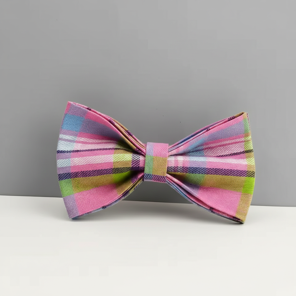 Colorful plaid bow tie on a gray background