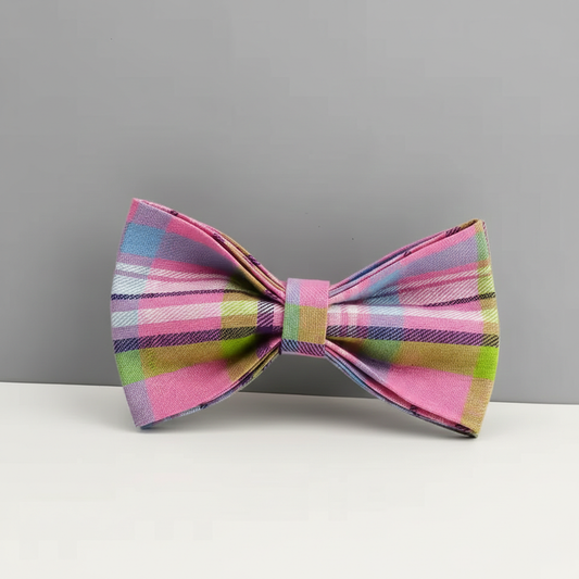 Colorful plaid bow tie on a gray background