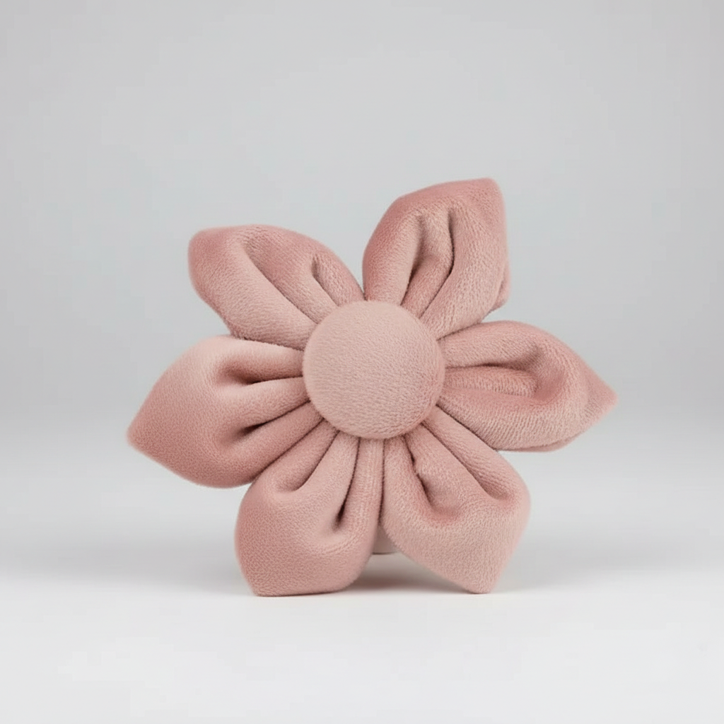 Pink flower-shaped cushion on a light gray background