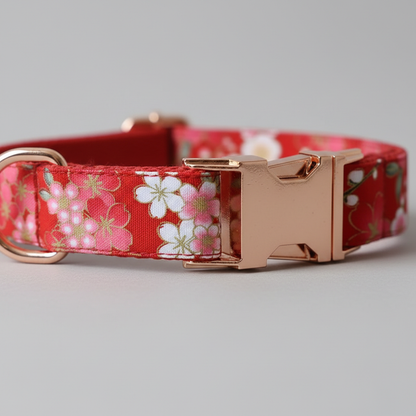 Dog collar with floral pattern and rose gold buckle on a gray background