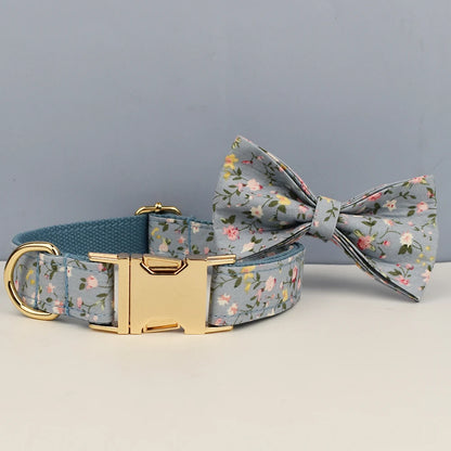 Floral-patterned dog collar and bow tie set on a neutral background