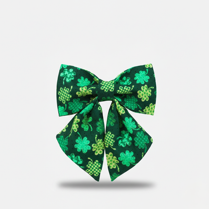 Green bow with shamrock pattern on a white background