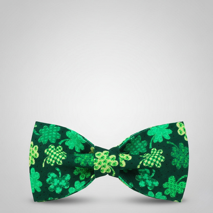 Green bow tie with clover pattern on a light gray background