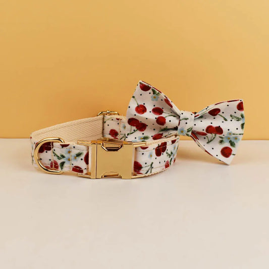 Dog collar and bow tie with floral pattern on a beige background
