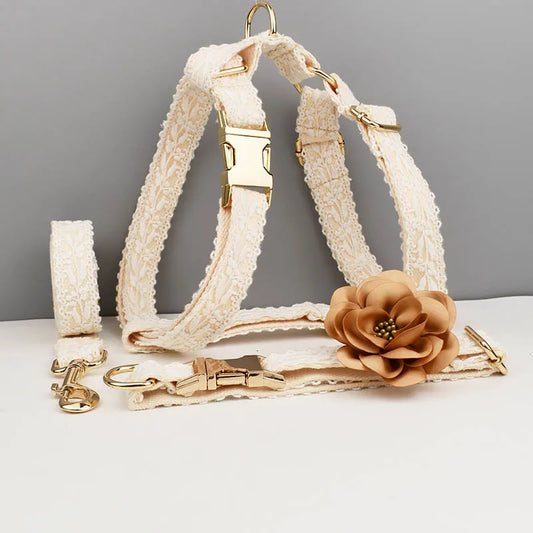 Dog harness with floral accessory on a gray background
