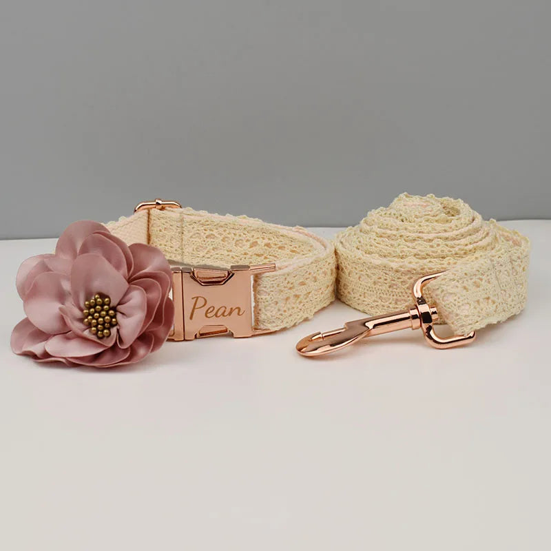 Dog collar with floral decoration and matching leash on a gray background