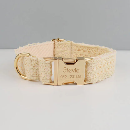 Beige dog collar with gold buckle and engraved nameplate on a light gray background
