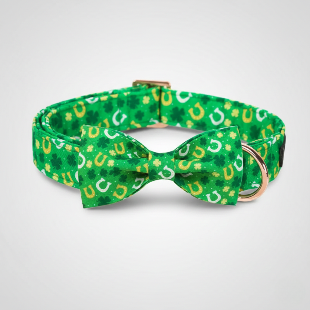 Green dog collar with a bow tie featuring lucky horseshoe pattern on a light gray background