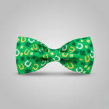 Green bow tie with lucky horseshoe and clover pattern on a gray background