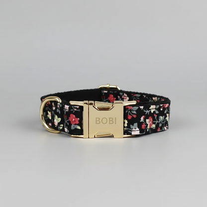 Floral dog collar with gold buckle on a gray background