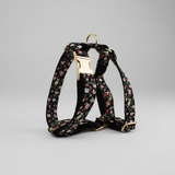 Floral-patterned dog harness on a gray background