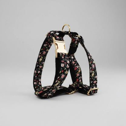 Floral-patterned dog harness on a gray background
