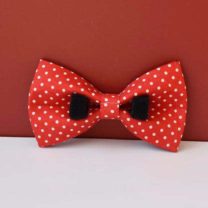 Red bow tie with white polka dots on a red background