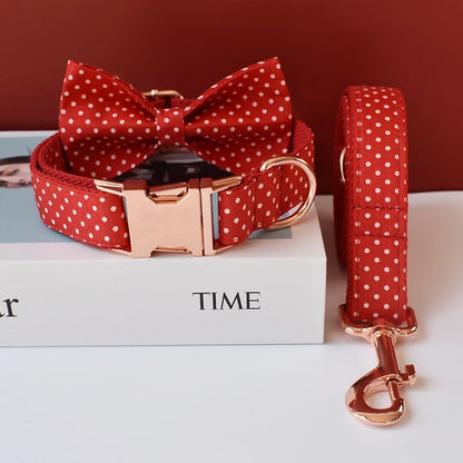 Red polka dot dog collar with bow tie and matching leash on a 'TIME' magazine