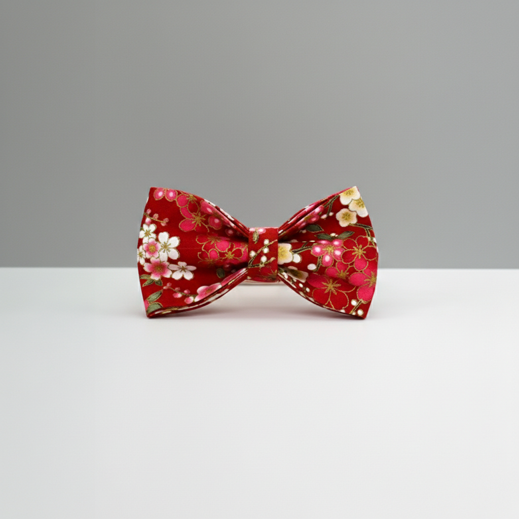 Red floral bow tie on a gray background
