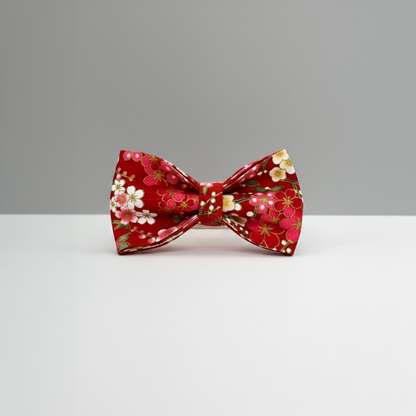 Red floral bow tie on a gray background
