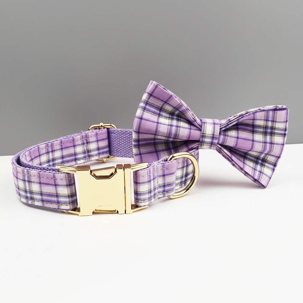 Purple plaid dog collar with a matching bow tie on a gray background