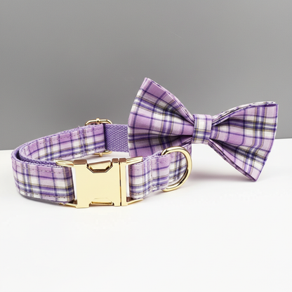 Purple plaid dog collar with a matching bow tie on a gray background